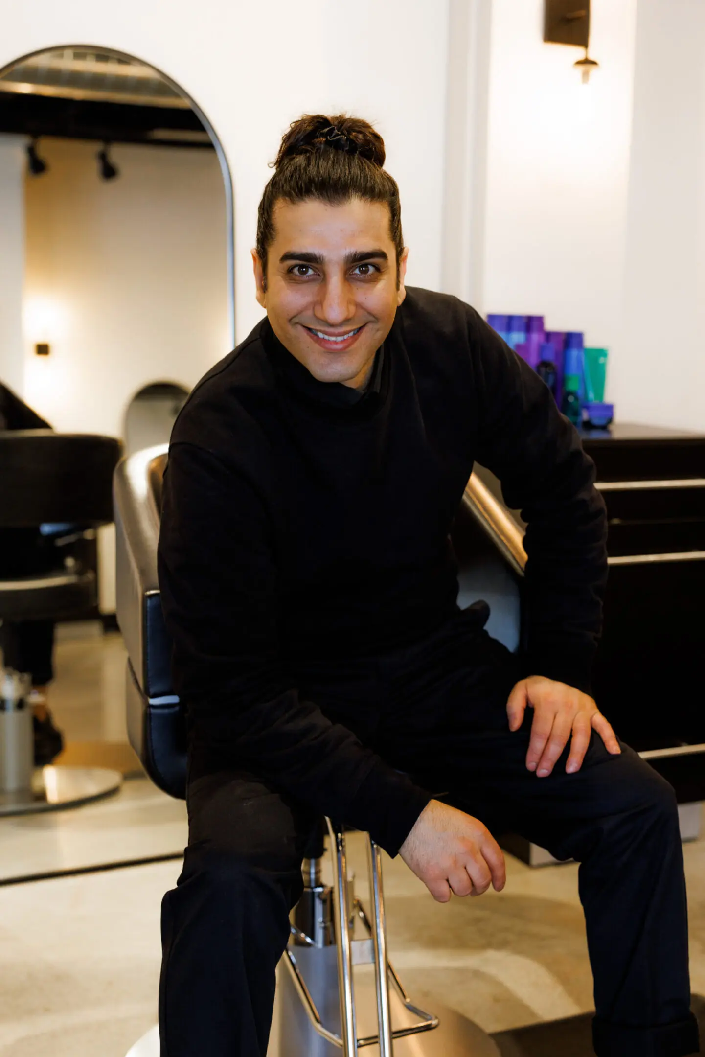 Person sitting on salon chair