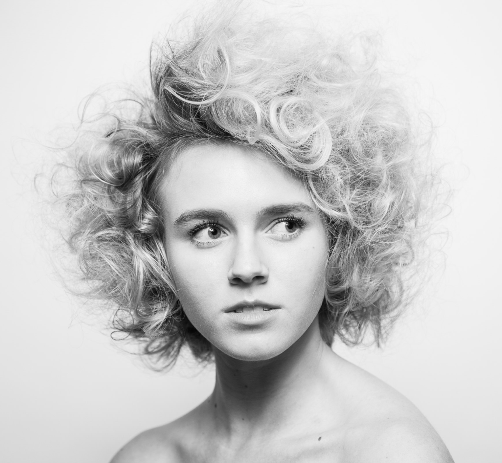Woman with curly hair, black and white