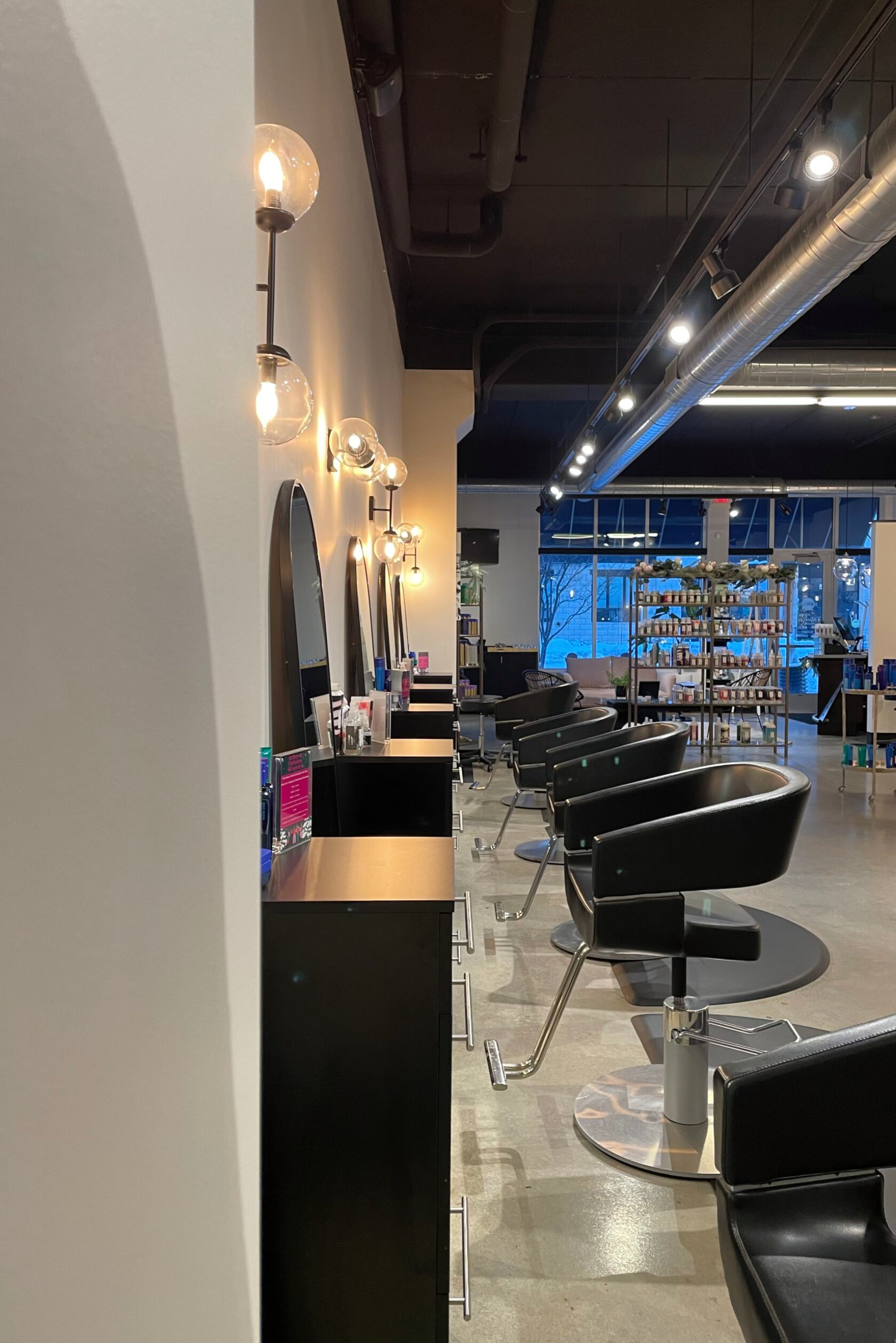 Modern hair salon interior with styling chairs.